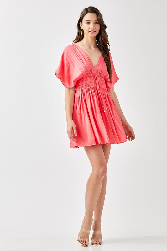 SMOCKED WAIST WITH TASSEL STRAP FLARE DRESS