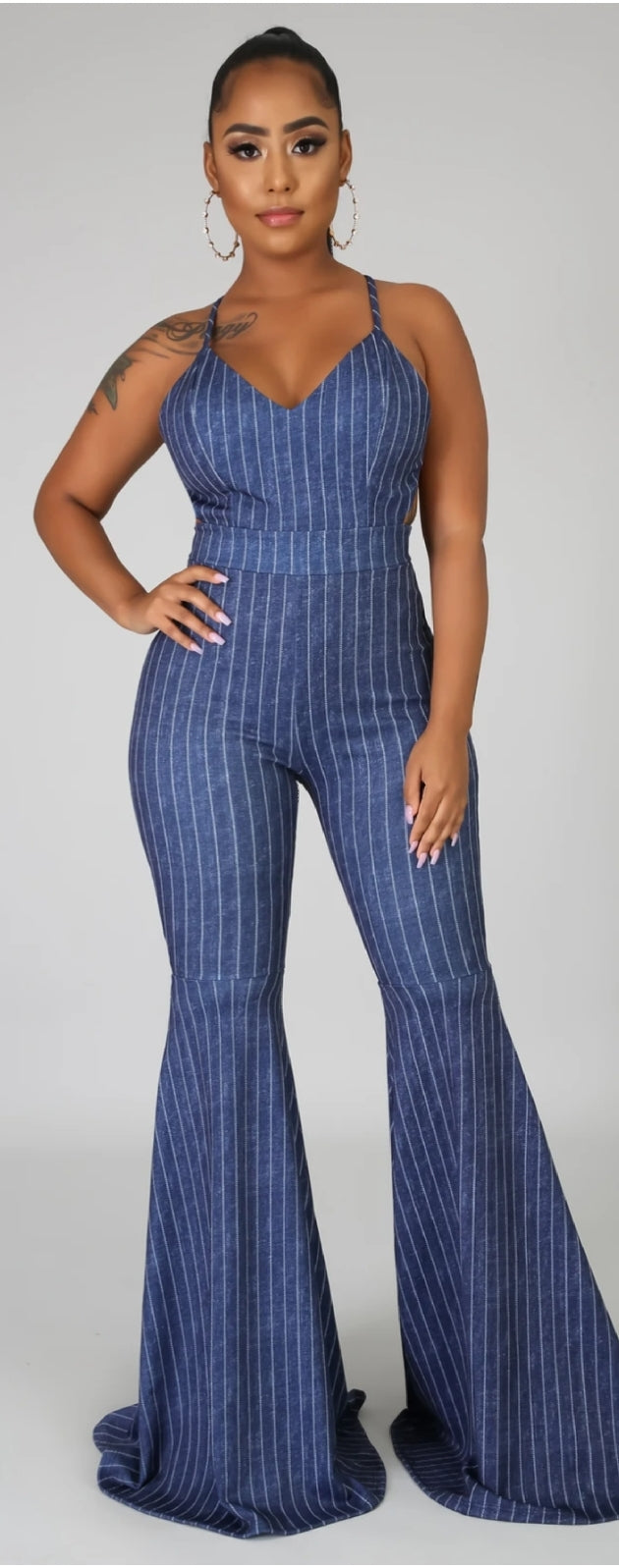 stretch denim criss cross back bell bottom jumpsuit